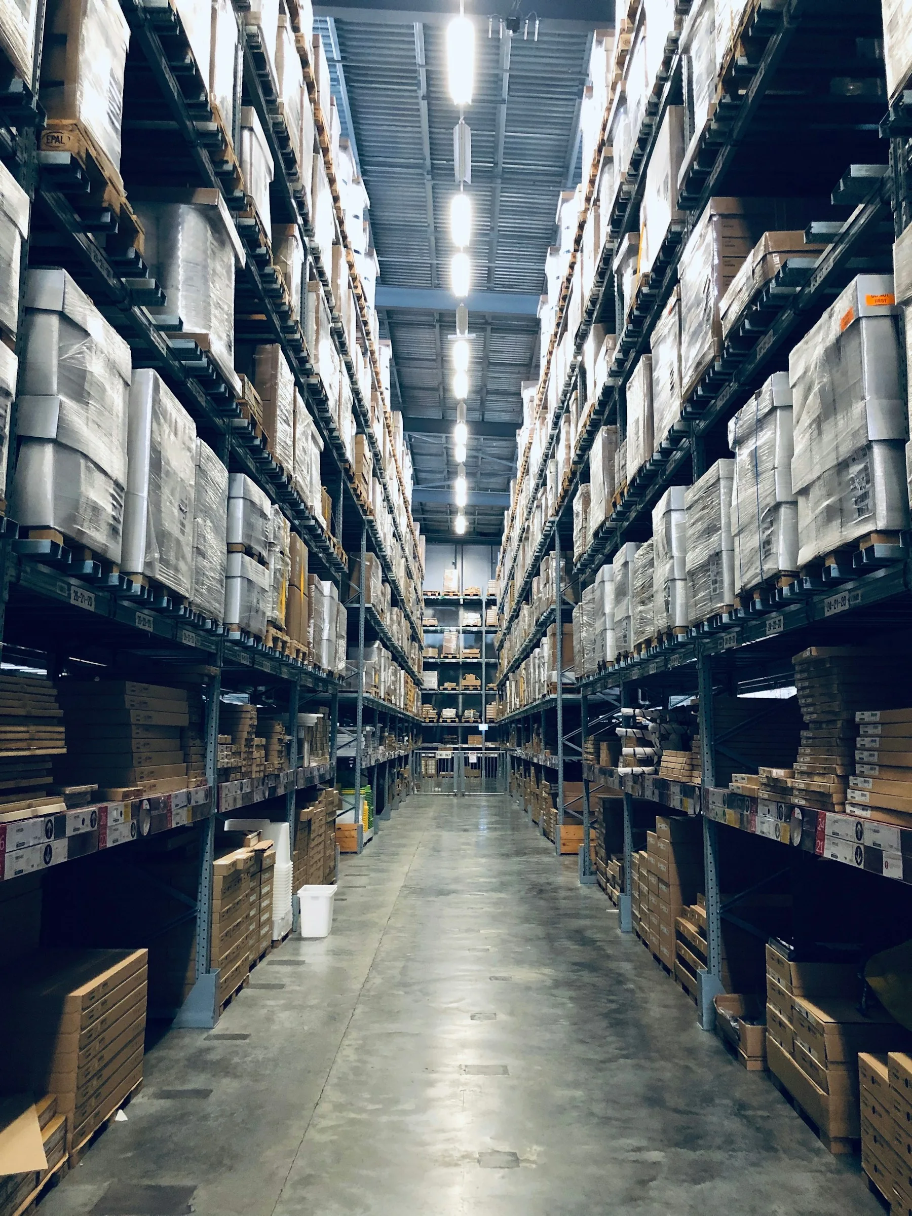 Illustrative photograph of organised warehouse shelving